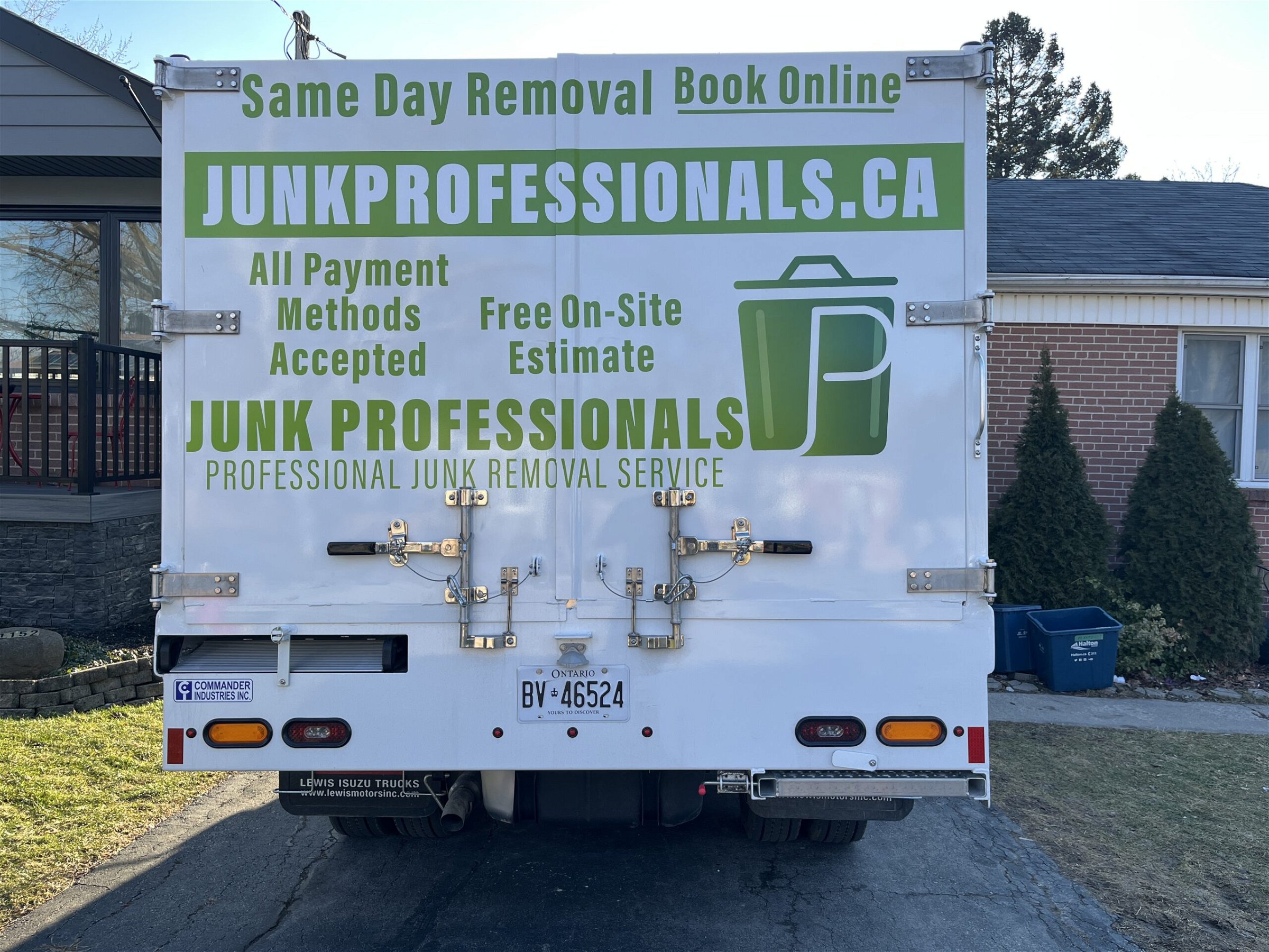 rear view of junk professionals' truck which going to pick up junk