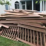Demolished deck that need to be removed is to be picked by junk professionals