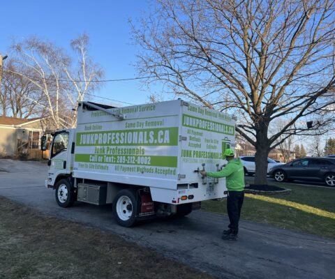 Junk professionals employee is opening a truck to provide Concrete Demolition & Removal