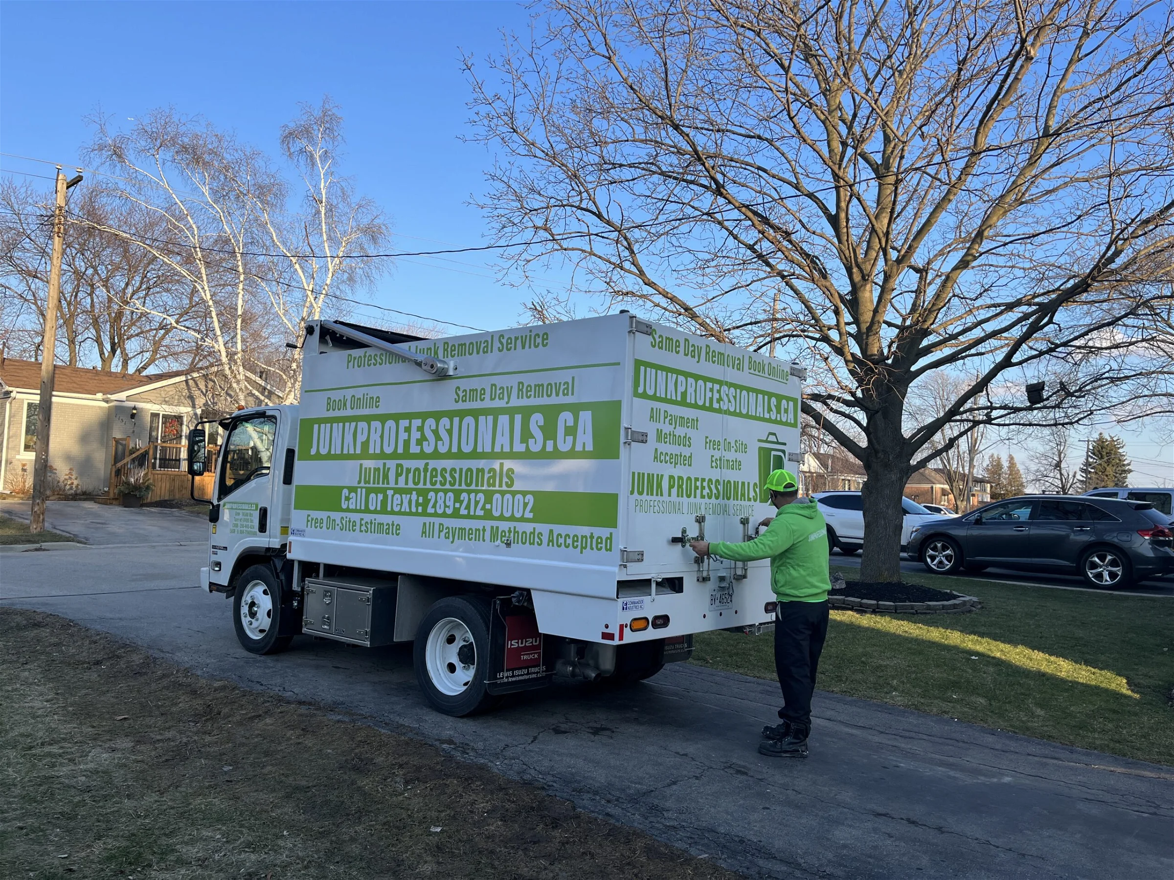 Junk professionals employee is opening a truck to provide Concrete Demolition & Removal
